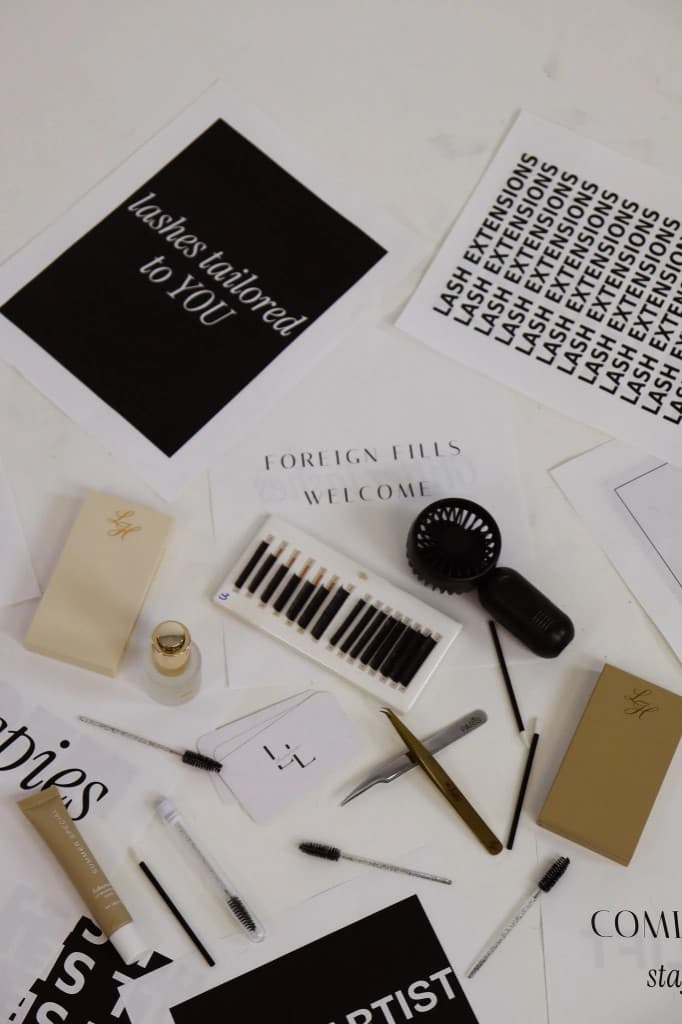 Lash extension supplies arranged on a studio table